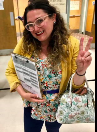 Student clipboard peace sign