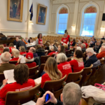Mom's Demand Action Harpies with red shirts advocating for full on gun control