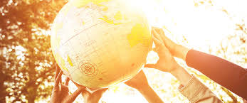 globe hands sunshine