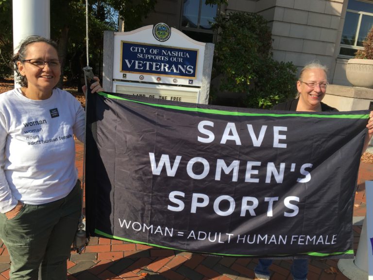 Raising Save Women's Sports flag in Nashua