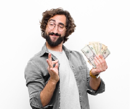 Young,Crazy,Cool,Man,With,Dollar,Banknotes,Against,White,Wall with money