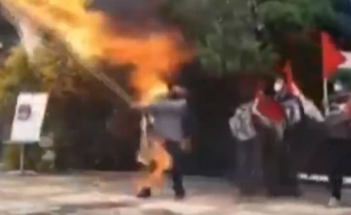 Iranian Man sets himself on fire burning Israeli flag