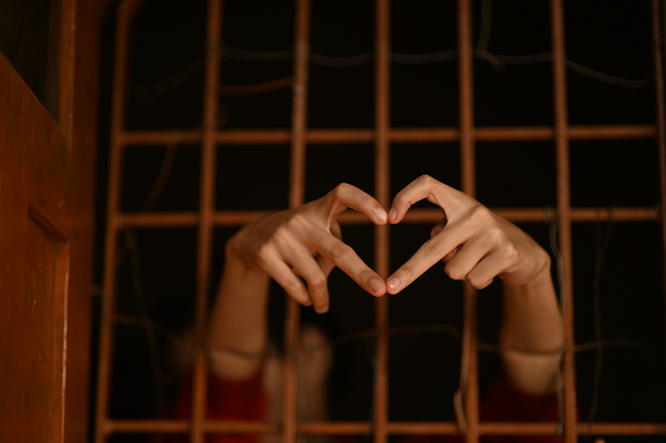 prison bars hands Jail heart Photo by Rajesh Rajput on Unsplash