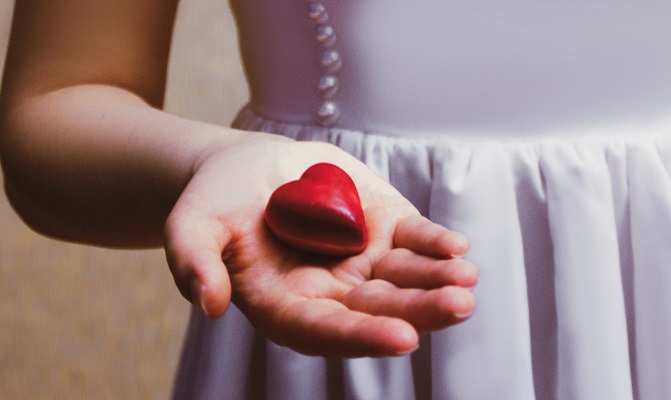 Young girl heart inhand