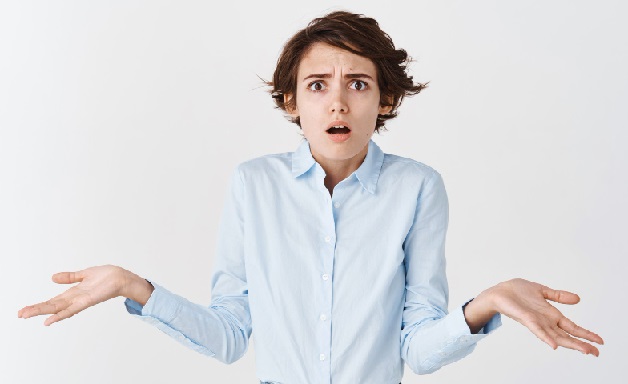 confused-anxious-young-woman-shrugging-shoulders-spread-hands-sideways-looking-puzzled-know-nothing-standing-white-wall FreePik