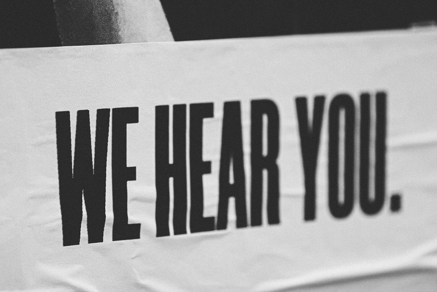 banner we hear you Photo by Jon Tyson on Unsplash