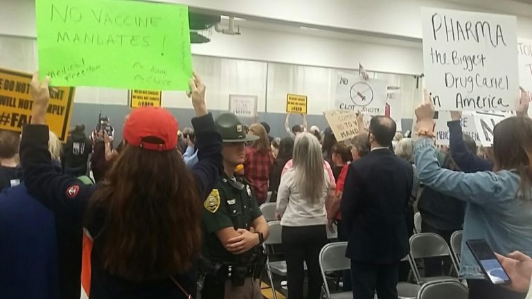 Backs to the Governor Sununu