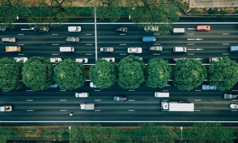 road vehicles cars trucks traffic original Photo by CHUTTERSNAP on Unsplash