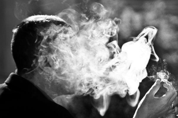 man smoke cigar