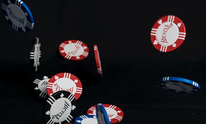 Poker chips falling original Photo by Apolo Photographer on Unsplash