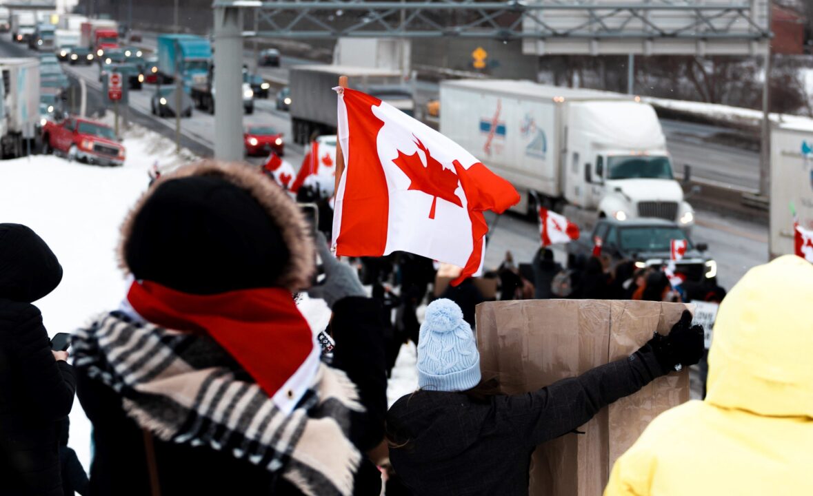 convoy truckers canadian flag original Photo by Dillon Kydd on Unsplash
