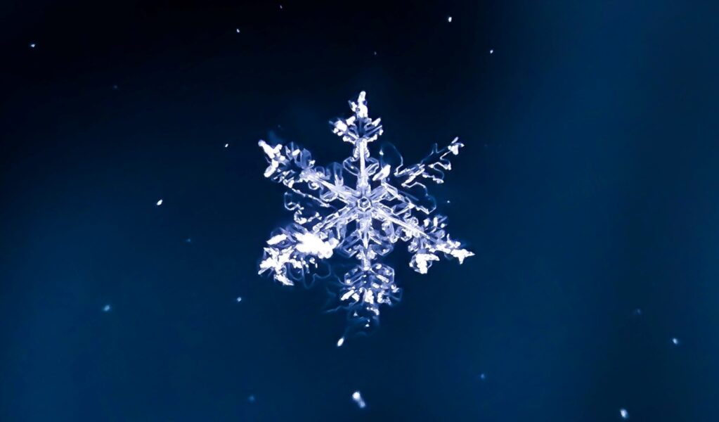 photo of a Snowflake original Photo by Darius Cotoi on Unsplash