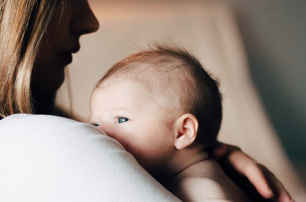 Mom and baby Original Photo by Hollie Santos on Unsplash