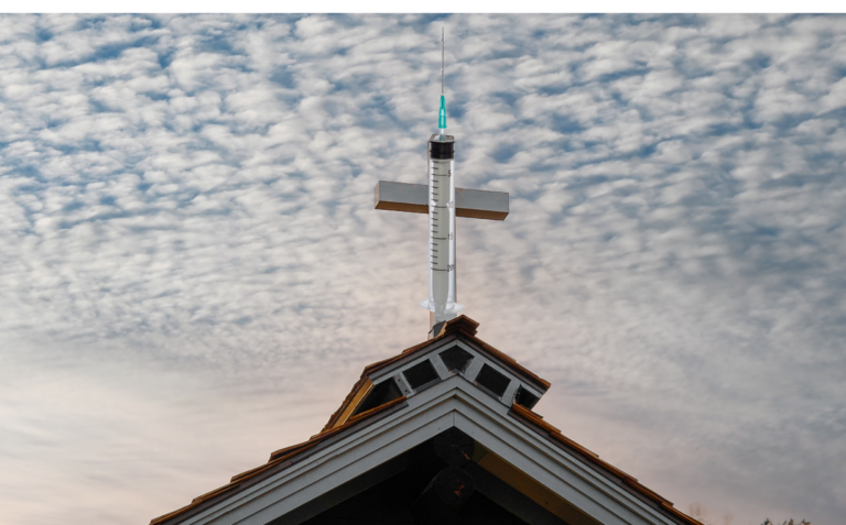 Cross on church with hypodermic needle