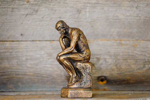 Think statue in miniature Photo by Kenny Eliason on Unsplash