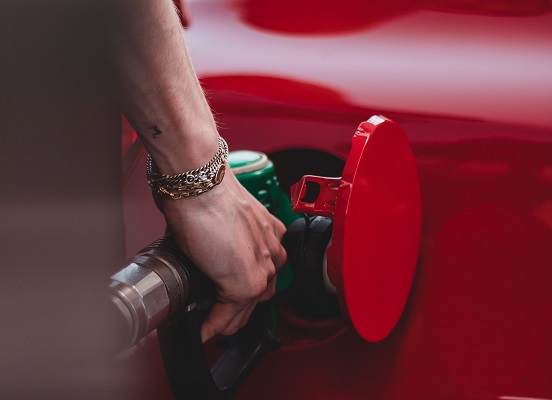 Gas nozzel gasoline fill it up pump original Photo by Wassim Chouak on Unsplash