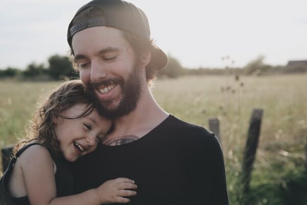 Father daughter laughing Photo by Caroline Hernandez on Unsplash