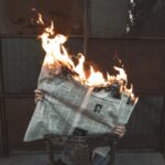 news newspaper fire original Photo by Jeremy Bishop on Unsplash