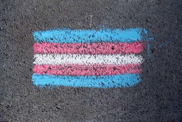 trans flag road chalk Photo by Katie Rainbow - pexels