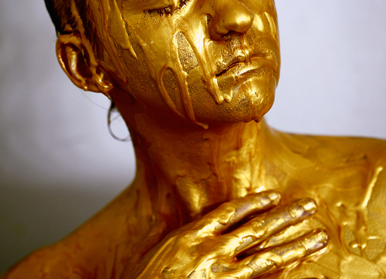 person covered in gold oscar like original Photo by Alexander Grey on Unsplash