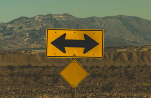 road sign arrows right or left original Photo by Pablo García Saldaña on Unsplash