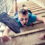 Guy falling down the stairs Photo by Sander Sammy on Unsplash