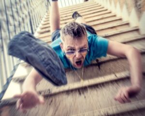 Guy falling down the stairs Photo by Sander Sammy on Unsplash
