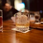 Higg-Ball glass on bar with ice and whisley