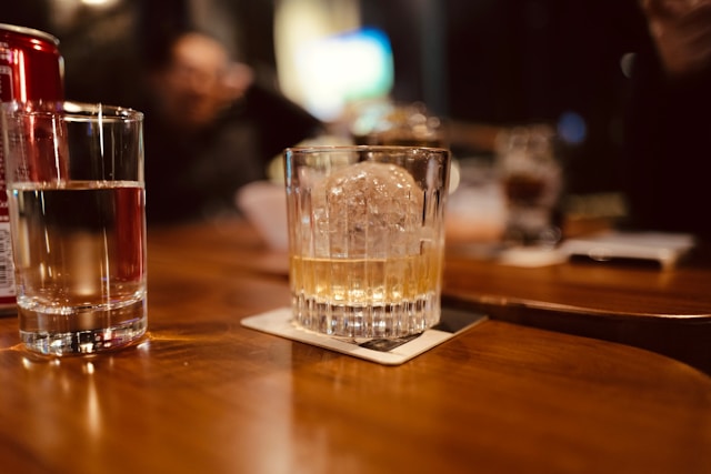 Higg-Ball glass on bar with ice and whisley
