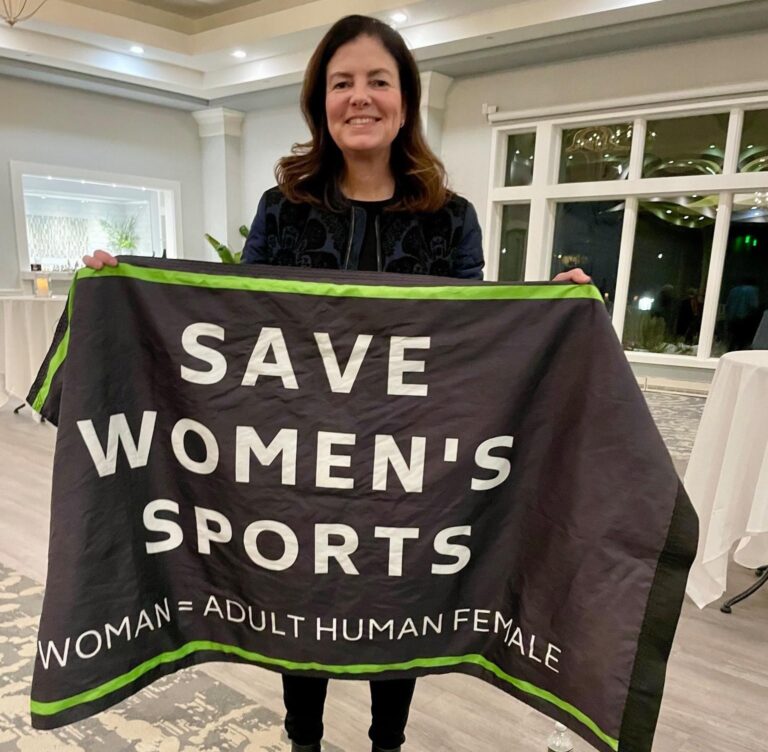 Gov Kelly Ayotte save womens sports flag - Beth Scaer