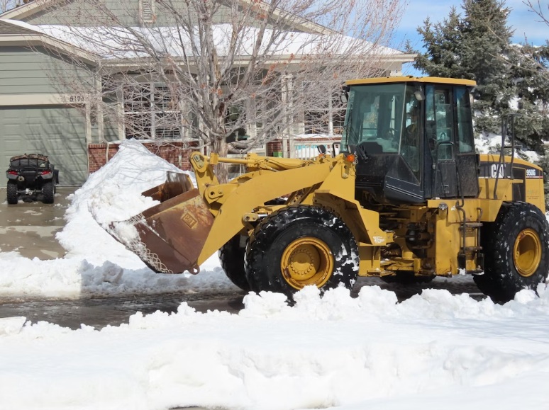 frontloader in the snow unsplash