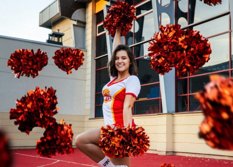 Cheerleader and pom poms