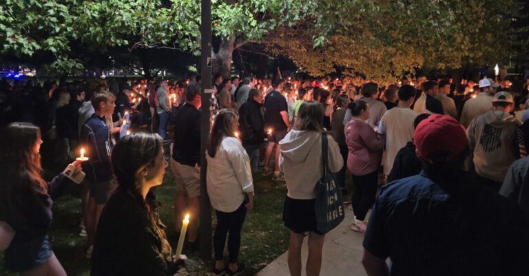 Photo of Charlie Kirk vigil. People holding candles