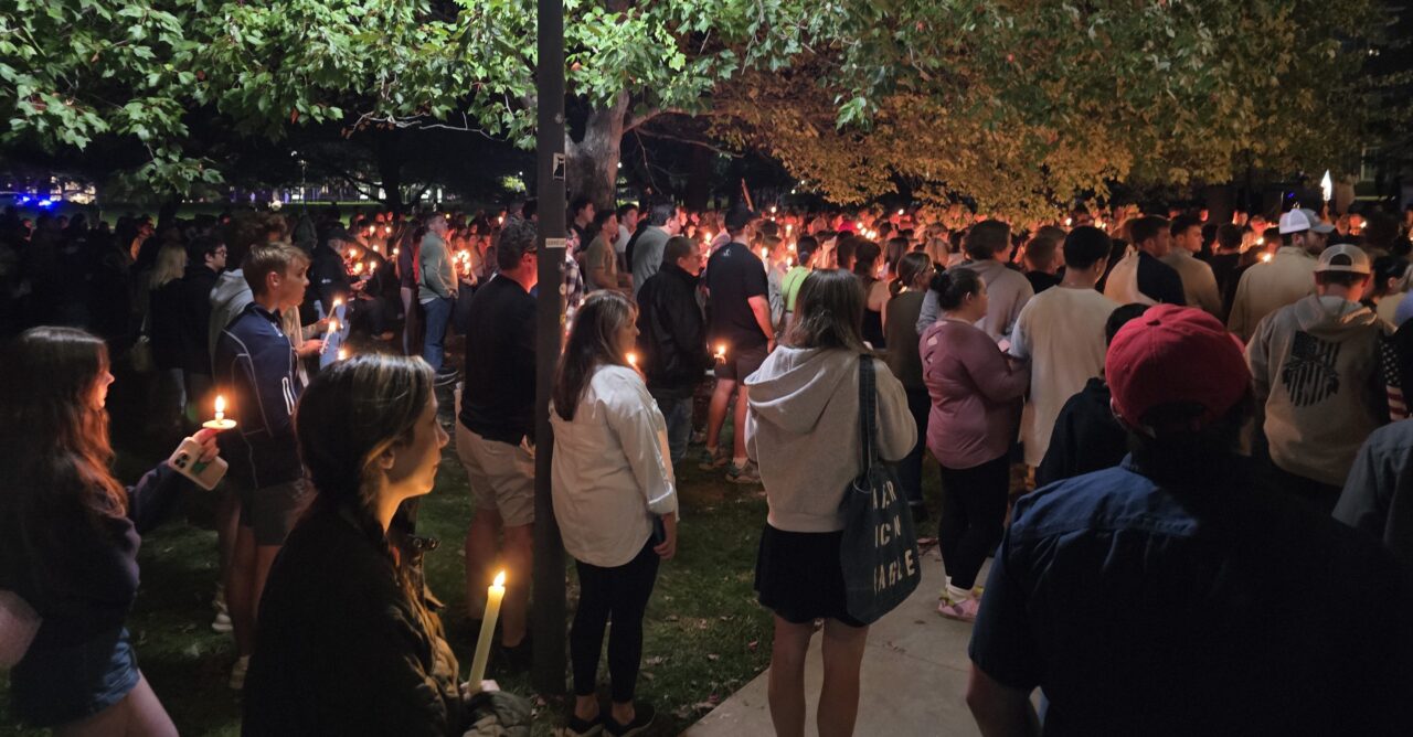 Photo of Charlie Kirk vigil. People holding candles