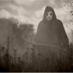 black and white photo of the reaper in ason mask