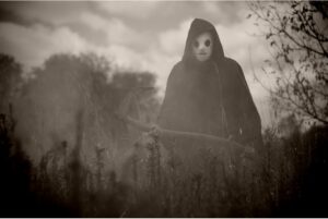 black and white photo of the reaper in ason mask