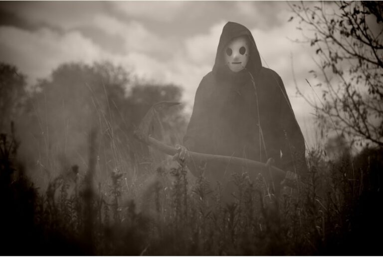 black and white photo of the reaper in ason mask