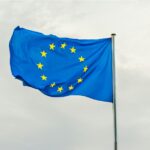 EU Europe flag on a pole in the wind