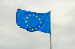 EU Europe flag on a pole in the wind