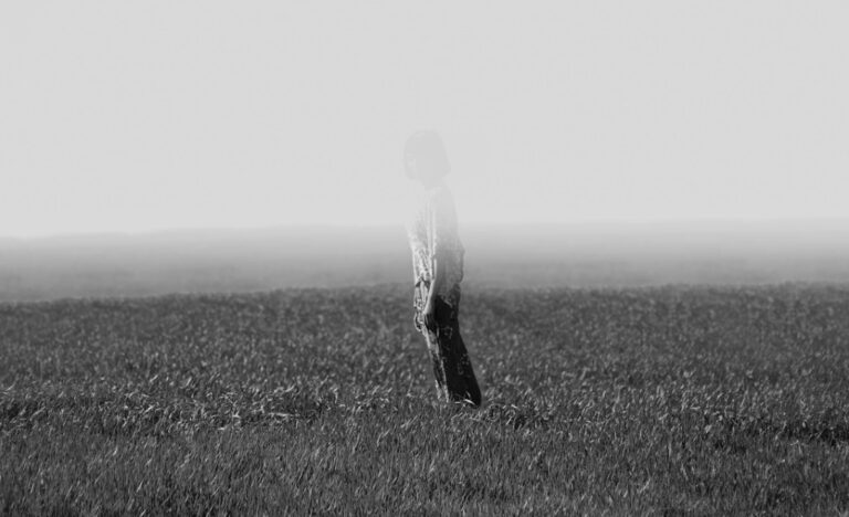 person fading away in them ist on a field