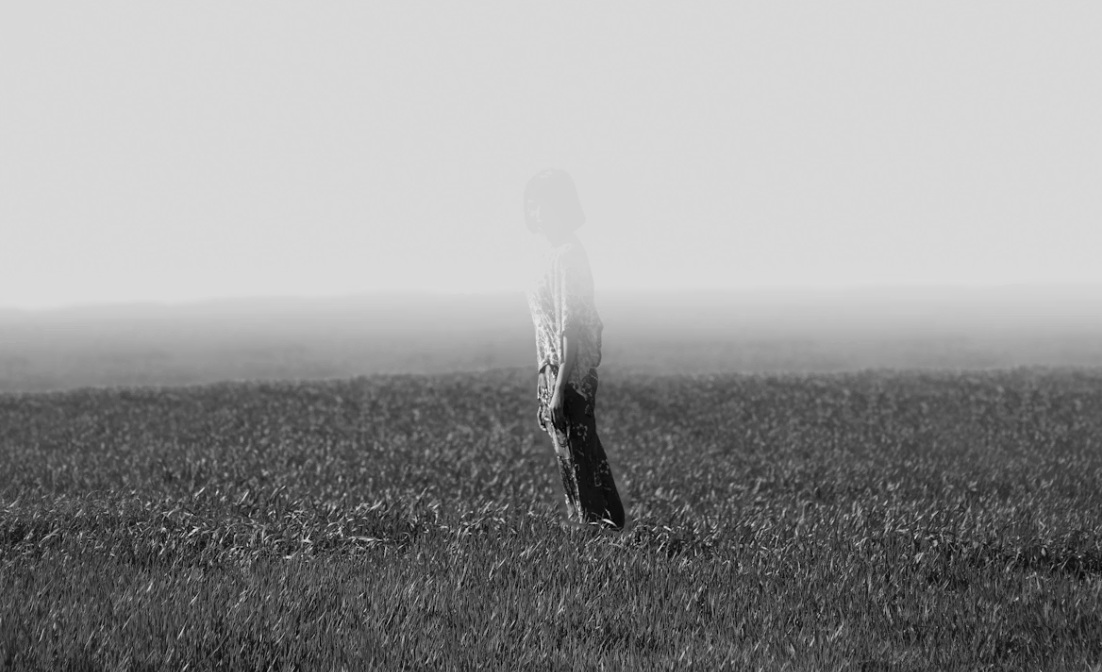 person fading away in them ist on a field