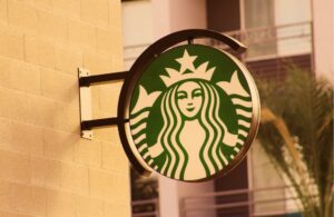 starbucks sign on the side of building