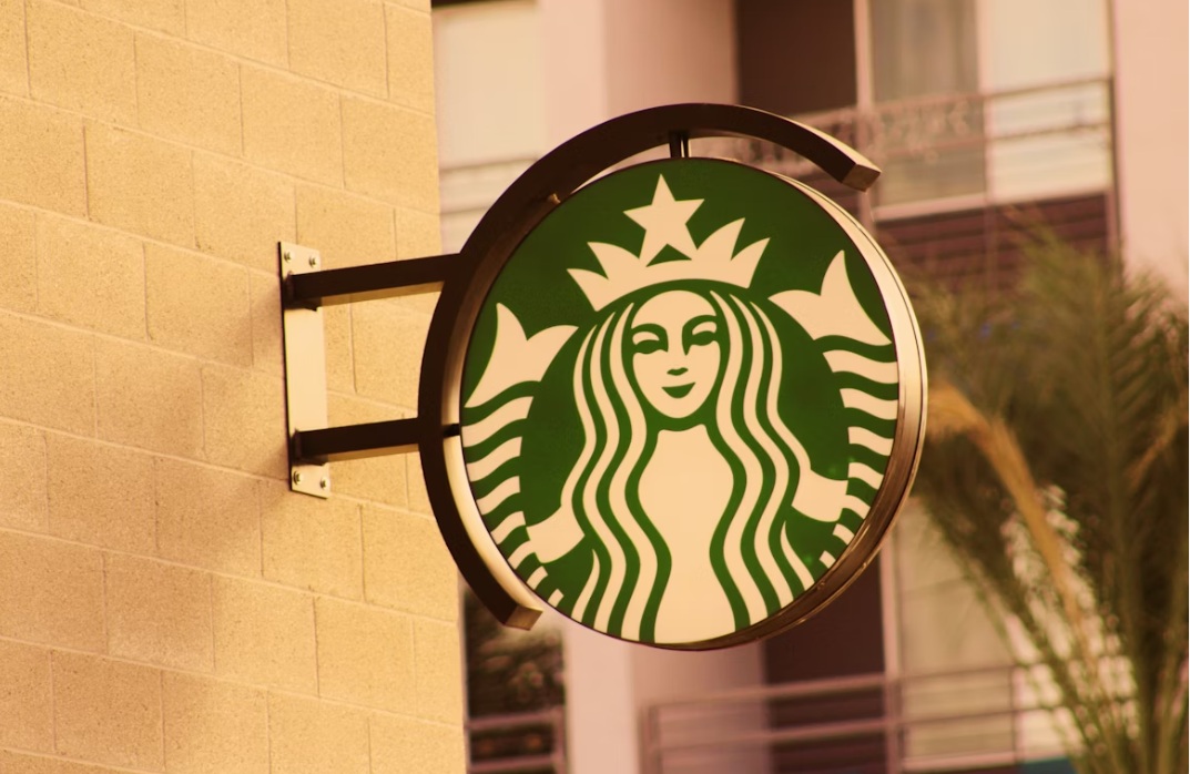 starbucks sign on the side of building