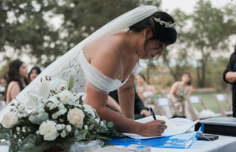 Weding day bride writing at a table