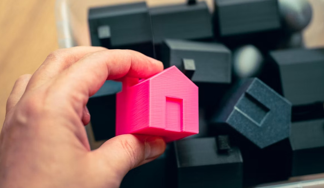 bin full of houses black and pink homes