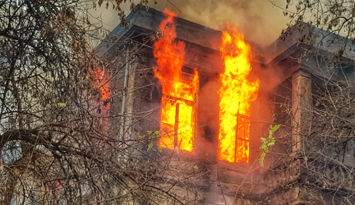 building or apartment fire flames in the window