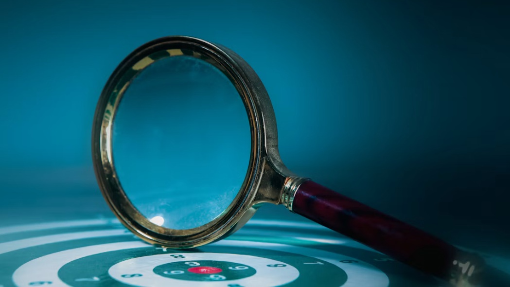 magnifying glass on a dartboard